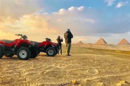 Beit Khufu – Atv Pyramids Two quad bikes parked in the desert with the Giza pyramids on the horizon