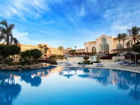 Beit Khufu – Cairo Luxor Hurghada A resort pool with palm trees in Hurghada
